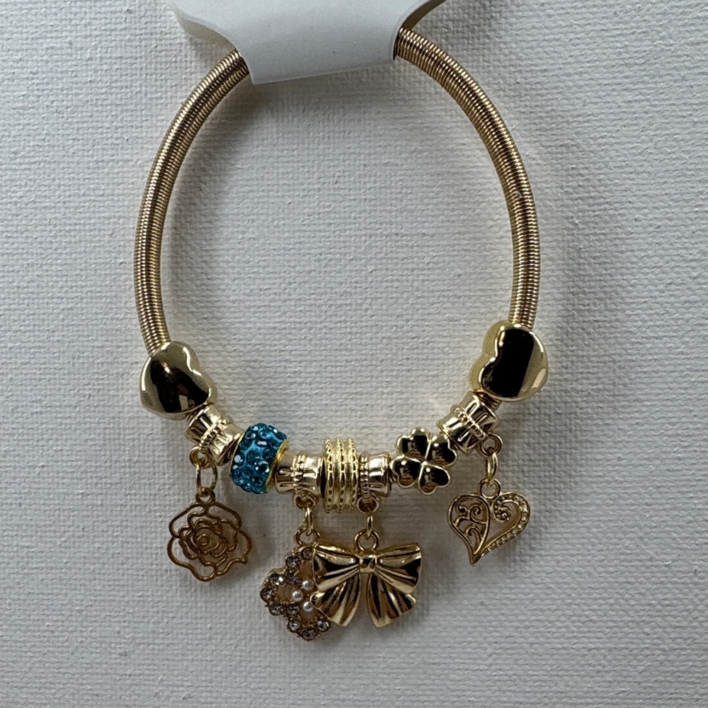 Gold tone Charm stretchy Bracelet with Blue Accents
